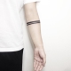 Tattoo on the arm in the form of stripes