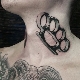 Brass knuckles tattoo