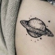 Tattoo in the form of the planet Saturn