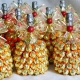 Decorating champagne with sweets for the New Year
