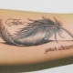 The meaning of a tattoo with a feather for girls and their variety