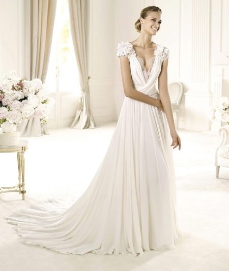 Wedding dress with deep neckline and short sleeves