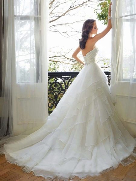 Lush wedding dress with a train multilayer