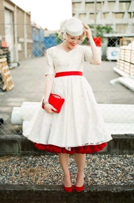 Stylish wedding dress with red accessories