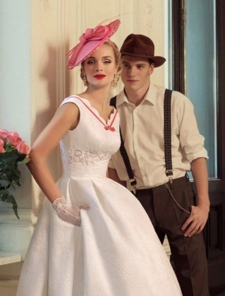 Retro style wedding dress paired with a groom suit
