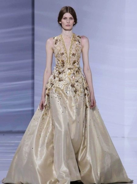 Beige evening dress with deep neckline