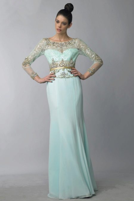 Evening dress in mint color with pastel notes