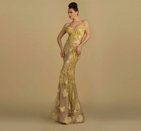 Yellow pattern on a beige base of an evening dress