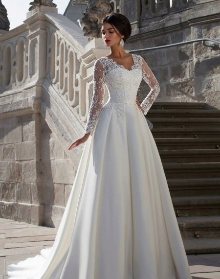Lush wedding dress with lace from Crystal Design