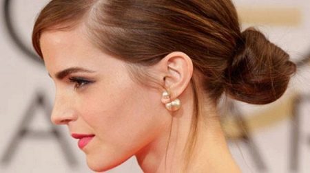 Stud earrings as a decoration for an outfit - a gold dress
