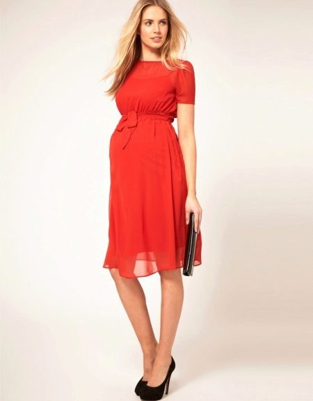 Red maternity dress with black shoes
