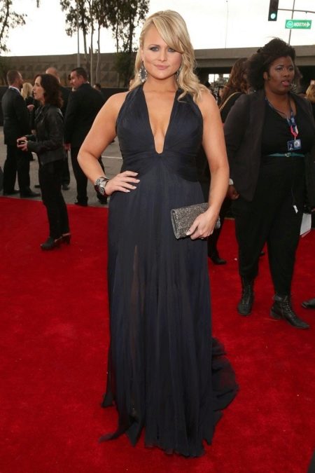 Black long dress to the floor with a deep neckline for pregnant women