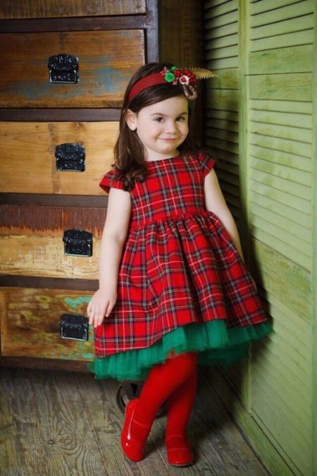 Elegant dress for a girl in a cage