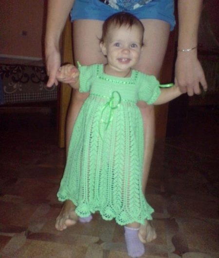 Decorating ribbons crocheted dress for girls up to 1 year