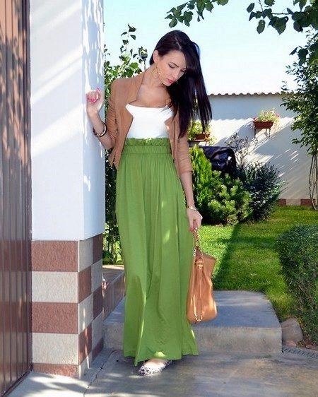 Long green half-sun skirt combined with a jacket