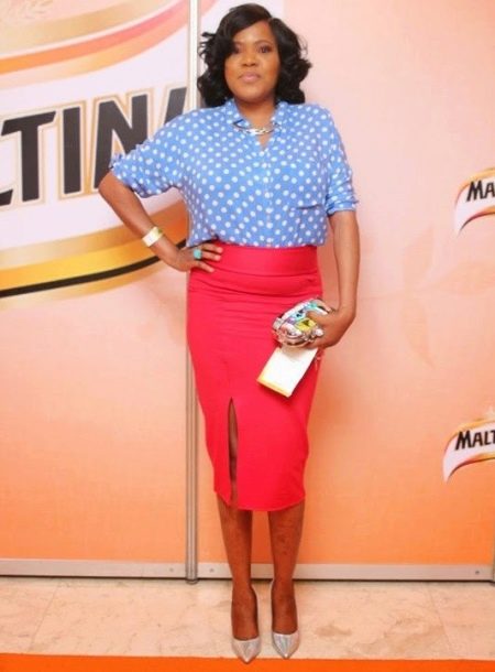 A red pencil skirt is not suitable for women with wide shoulders and with an apple-type figure